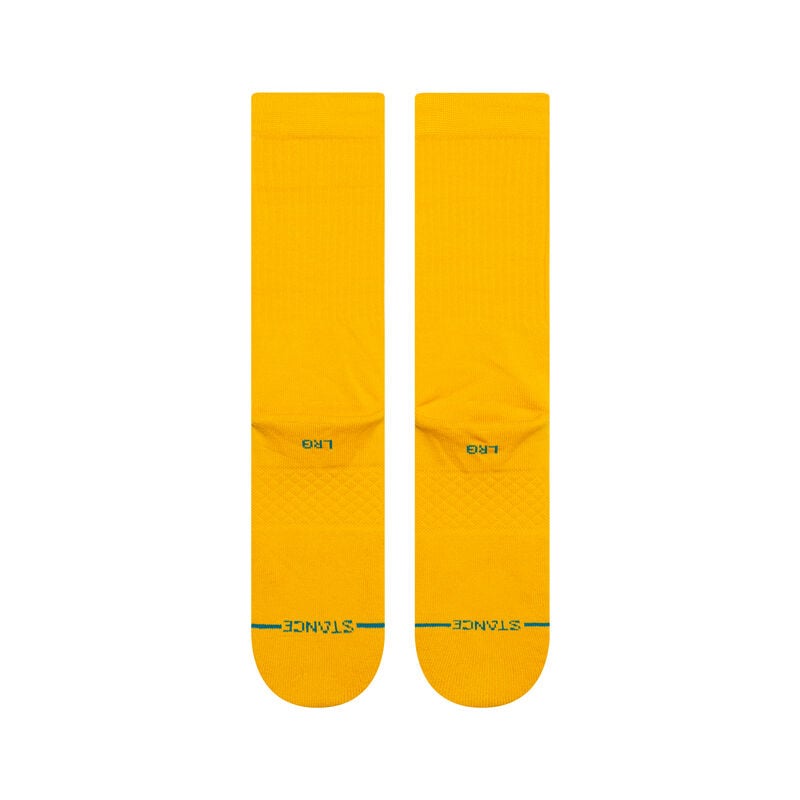Lifestyle image of Stance mens Icon Solid Color Cotton Crew Socks worn with casual shoes, emphasizing their versatility and everyday style.