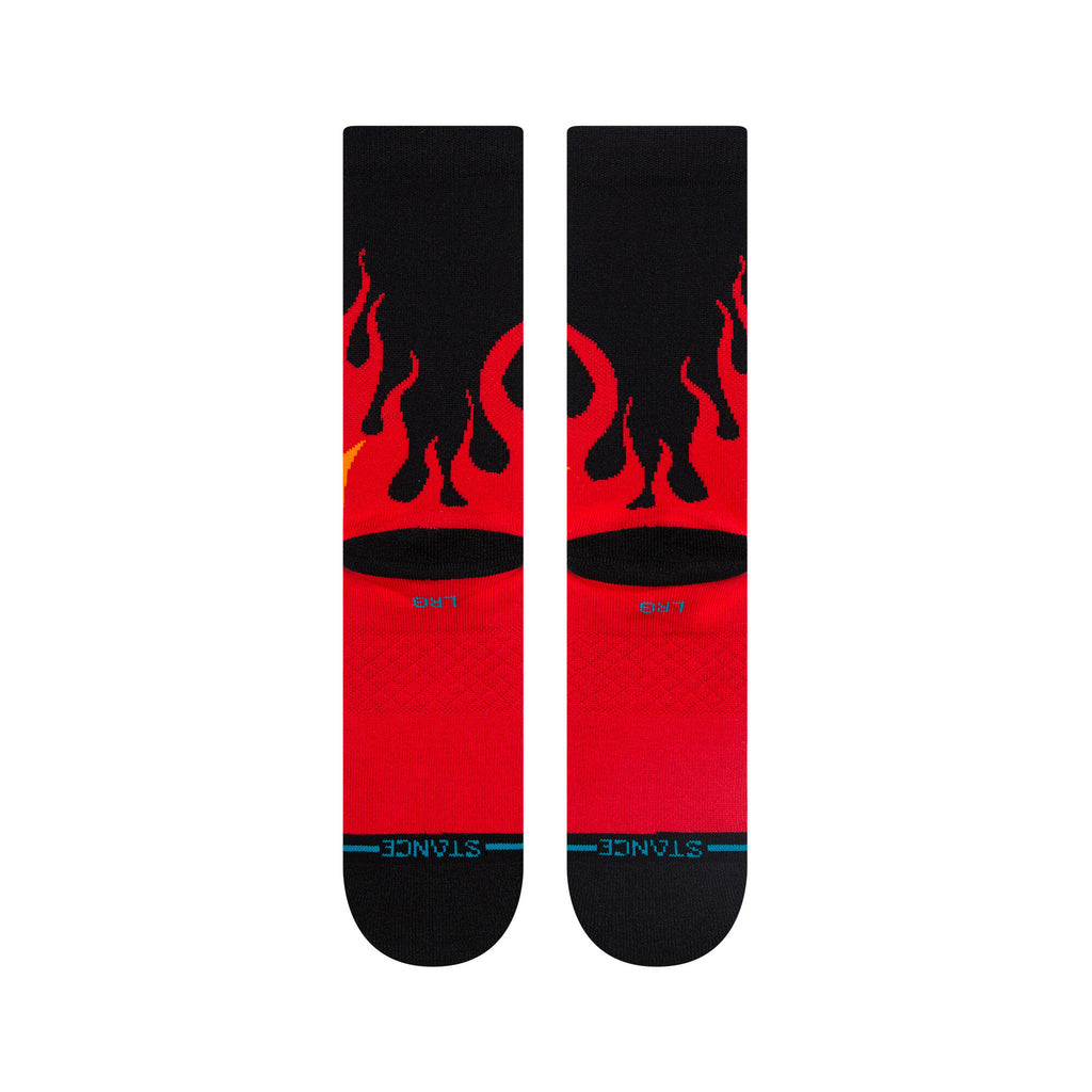 Lifestyle image of Stance Hot Wheels Hot Licks Crew Socks in Black being worn, emphasizing style and casual comfort.
