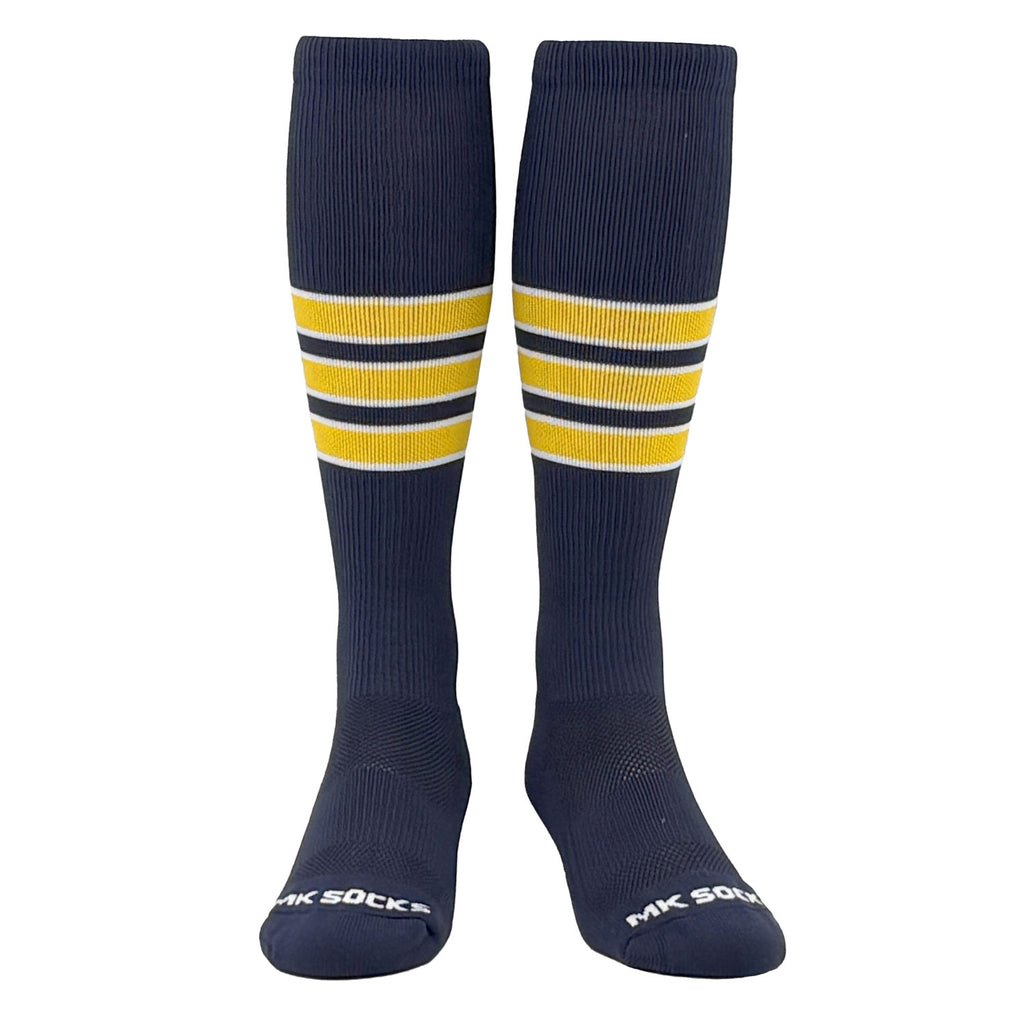 A pair of navy knee-high sports socks with white and gold stripes, designed for athletes.