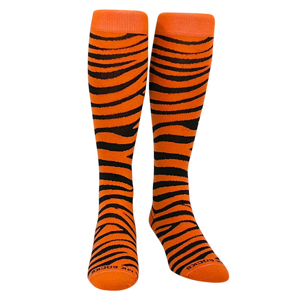 A pair of orange and black tiger striped sports socks designed for multiple sports, reaching up to the knee.