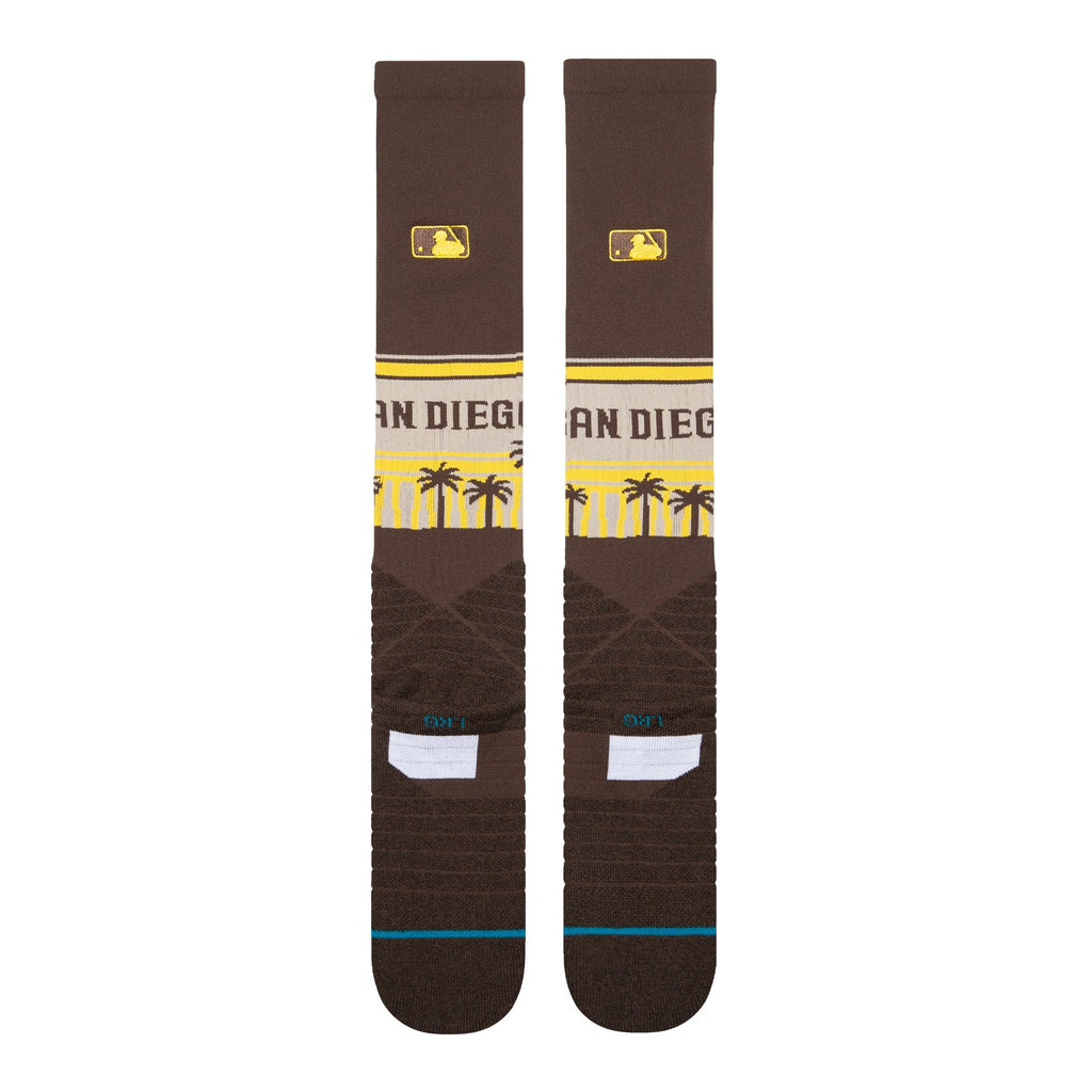 Lifestyle image of a person wearing Stance MLB San Diego Padres Diamond Pro Palms OTC Socks, combining style with athletic functionality.