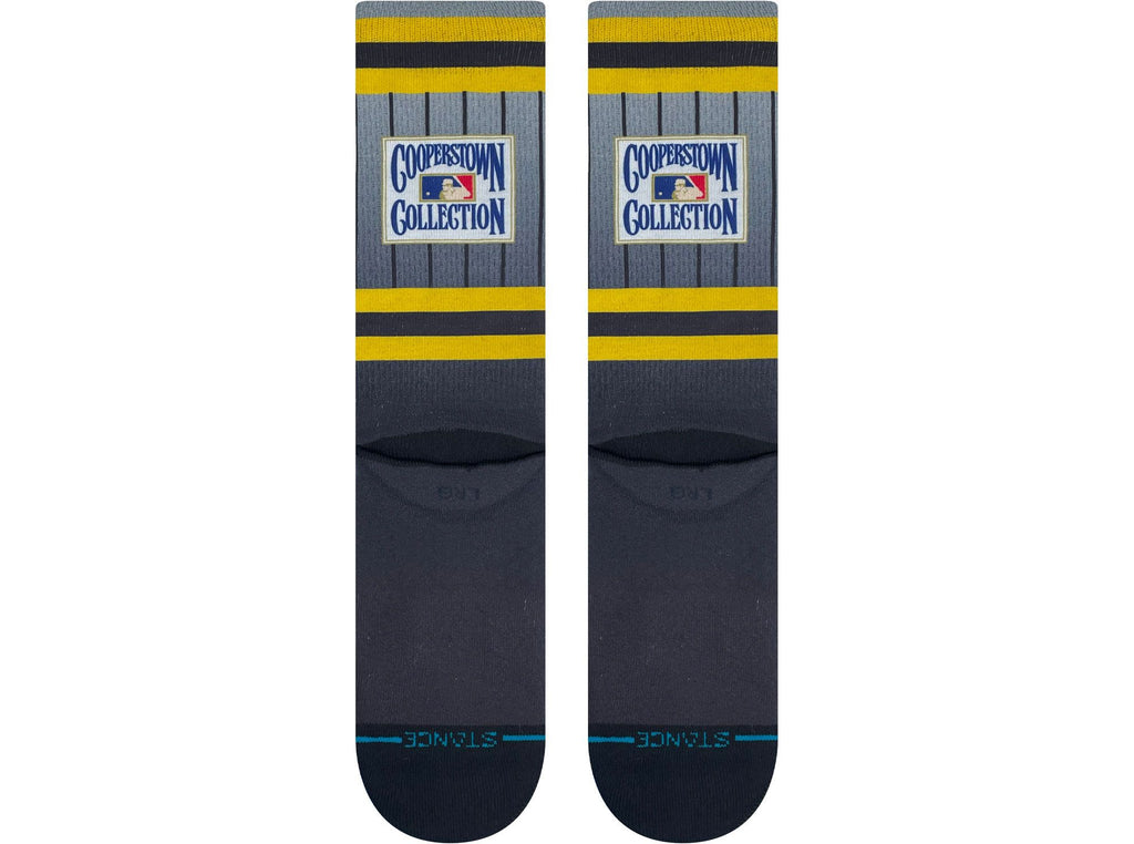 Stance Pittsburgh Pirates 2023 Cooperstown Crew Sock worn by a fan at a baseball game, emphasizing team spirit and all-day arch support.