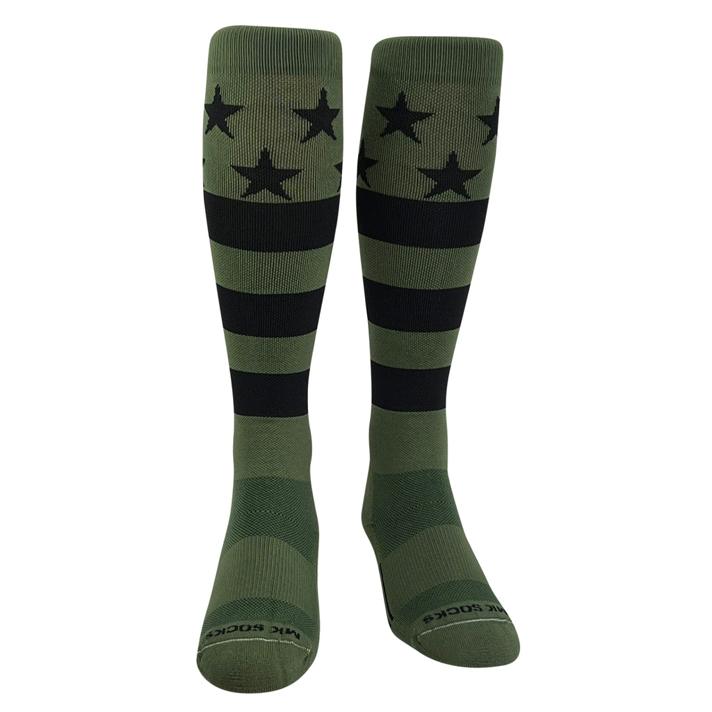 A pair of knee-high sports socks with a USA flag design in olive green and black featuring stars and stripes used in baseball and football.