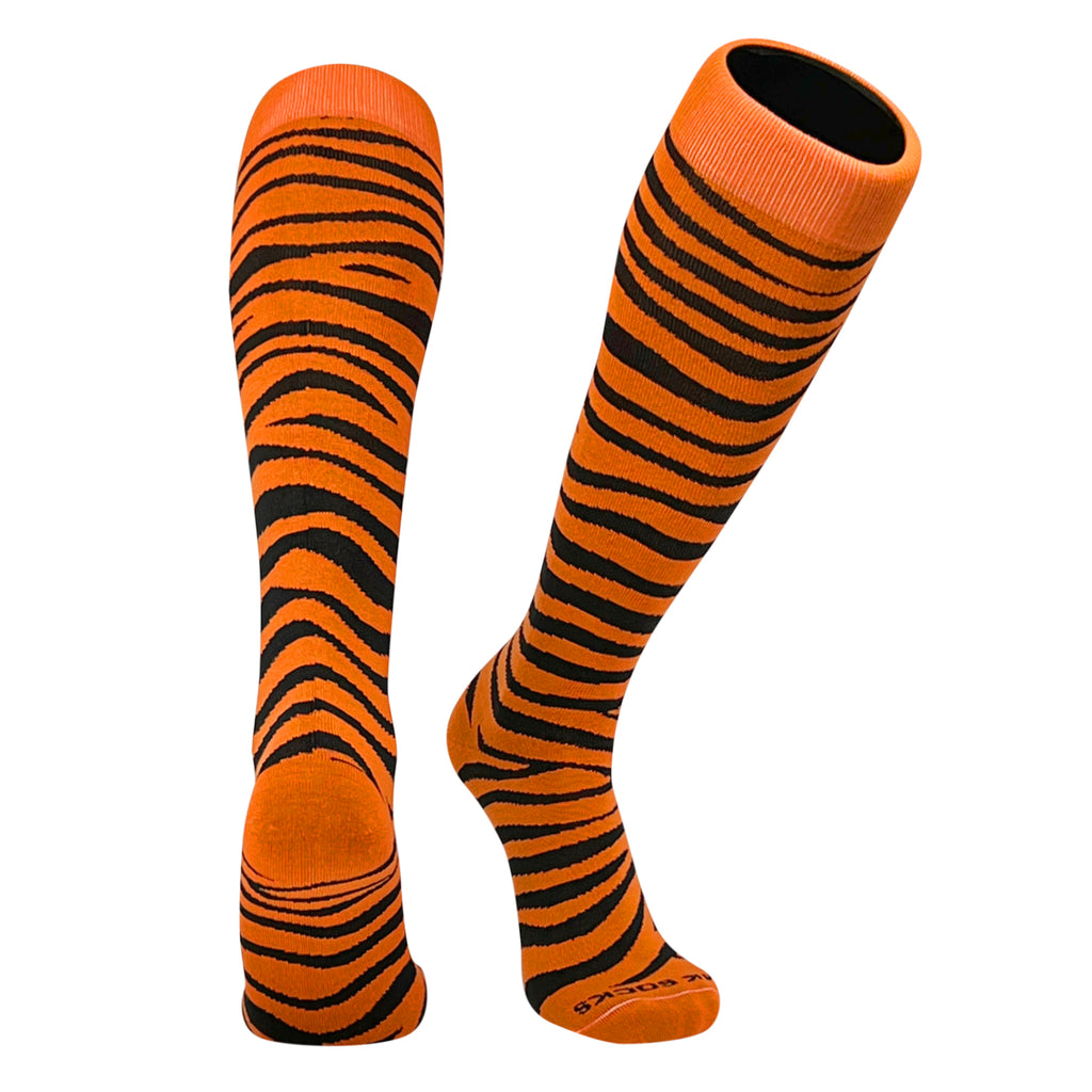 A pair of orange and black tiger striped sports socks designed for multiple sports, reaching up to the knee.